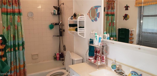 full bathroom with shower / bath combo with shower curtain, vanity, and toilet