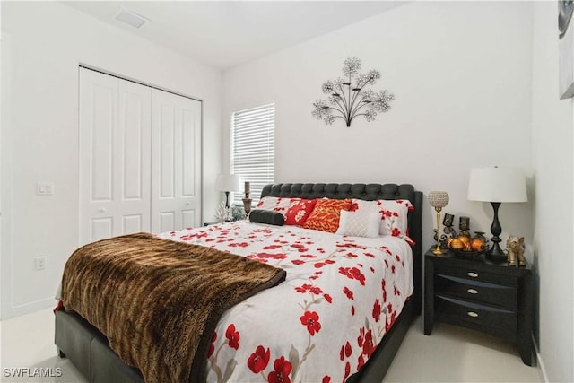 carpeted bedroom with a closet