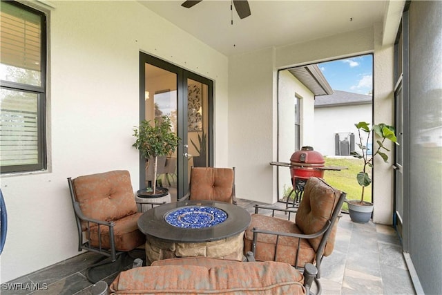 sunroom / solarium with ceiling fan