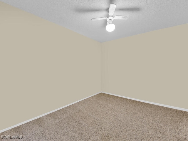 carpeted empty room featuring a textured ceiling and ceiling fan