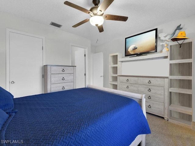 unfurnished bedroom featuring ceiling fan and a textured ceiling