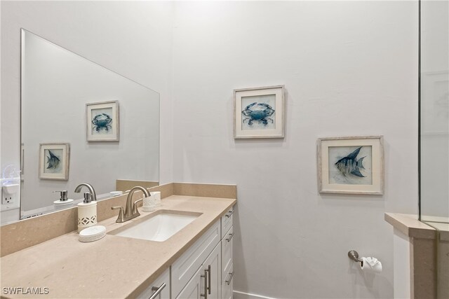 3967 Skyway Dr Unit 14, Naples, FL 34112 - bathroom with vanity and baseboards
