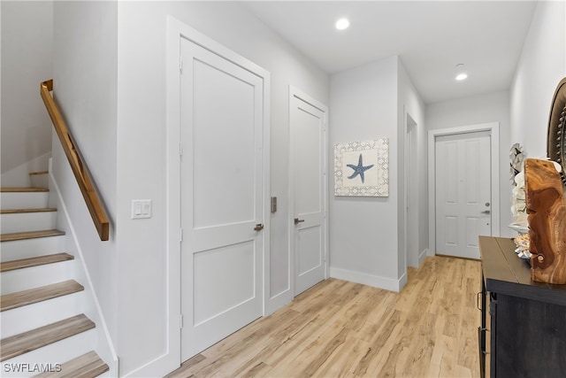 hall with light hardwood / wood-style floors