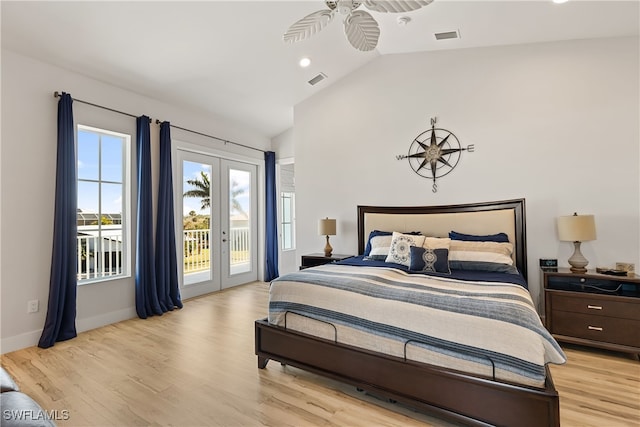3967 Skyway Dr Unit 14, Naples, FL 34112 - bedroom with access to exterior, french doors, light wood-style floors, baseboards, and high vaulted ceiling