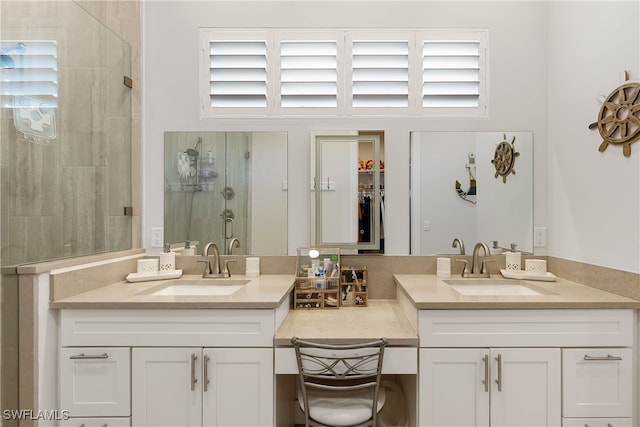 bathroom with vanity and an enclosed shower