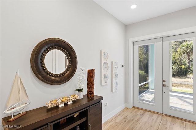 3967 Skyway Dr Unit 14, Naples, FL 34112 - entryway with light wood-type flooring, baseboards, recessed lighting, and french doors