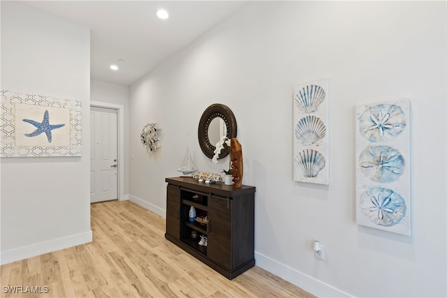 3967 Skyway Dr Unit 14, Naples, FL 34112 - hall with baseboards, light wood-style flooring, and recessed lighting