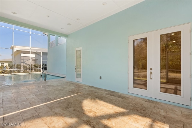 view of pool with french doors