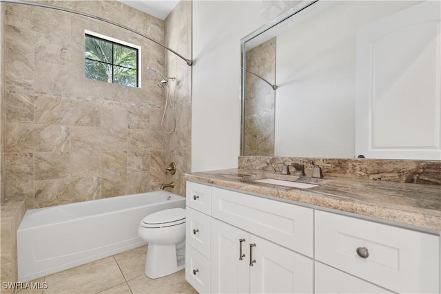 full bathroom with tile patterned floors, vanity, toilet, and tiled shower / bath