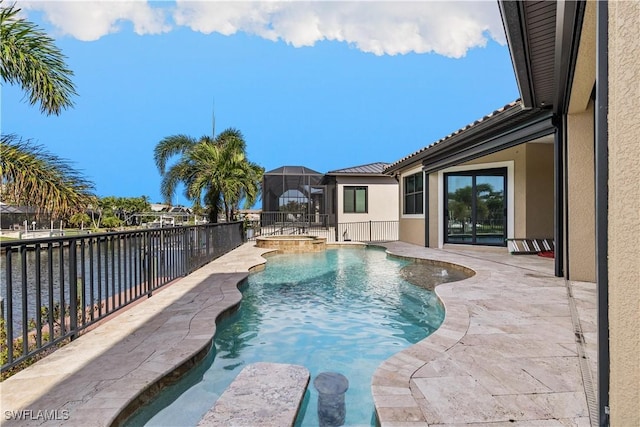 view of swimming pool with a lanai and an in ground hot tub