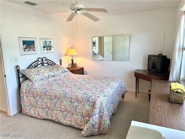 bedroom featuring carpet floors, baseboards, and visible vents