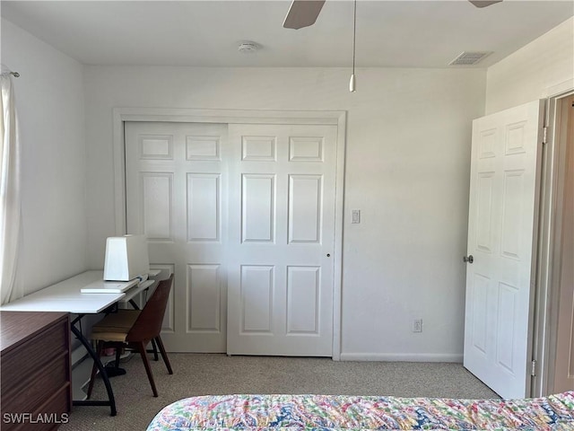 carpeted bedroom featuring a closet, visible vents, ceiling fan, and baseboards