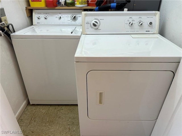 laundry room featuring laundry area and washing machine and clothes dryer