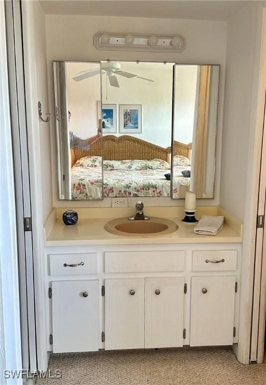 bathroom with ceiling fan and vanity