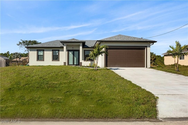 prairie-style home with a garage and a front yard