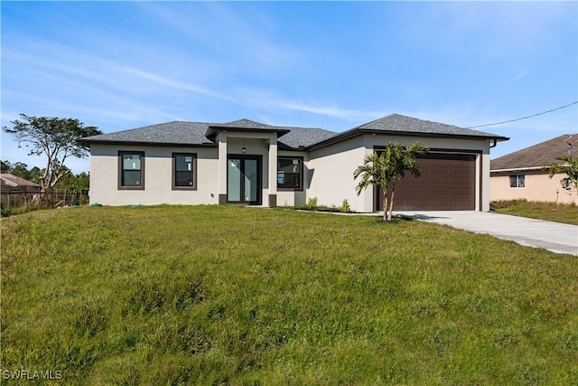 prairie-style home with a garage and a front yard