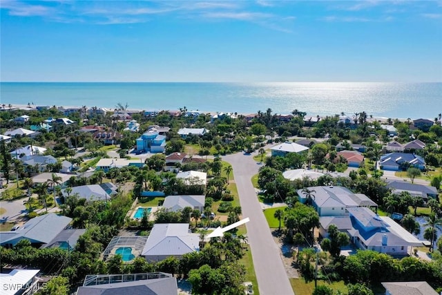 bird's eye view with a water view and a residential view