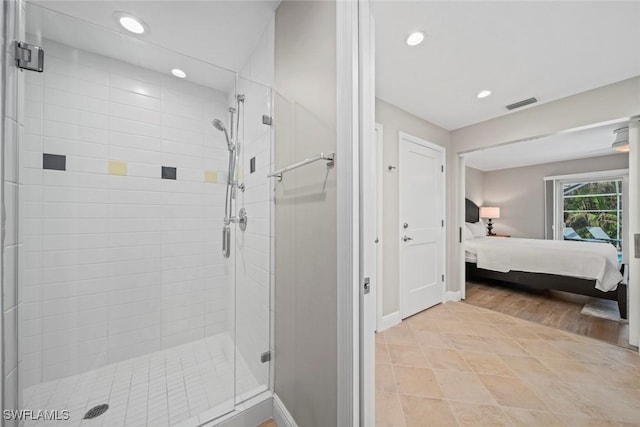 bathroom featuring a stall shower, recessed lighting, and ensuite bathroom