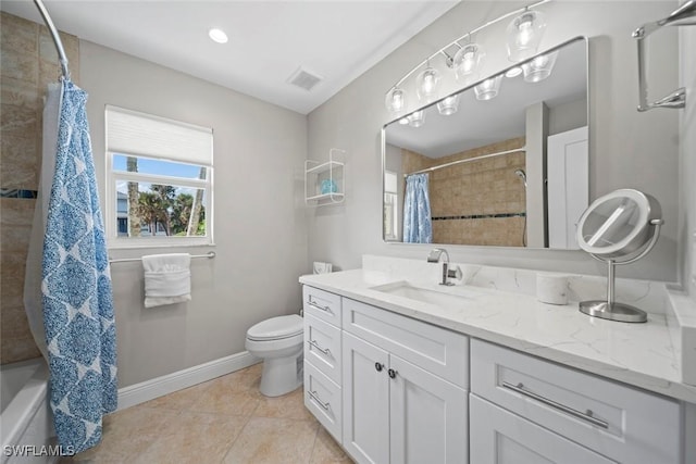 bathroom with toilet, vanity, baseboards, visible vents, and tile patterned floors