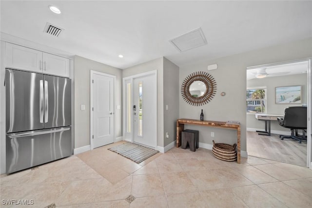 entrance foyer with recessed lighting, visible vents, baseboards, and light tile patterned floors