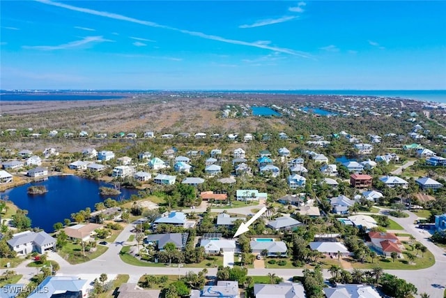 bird's eye view with a water view and a residential view