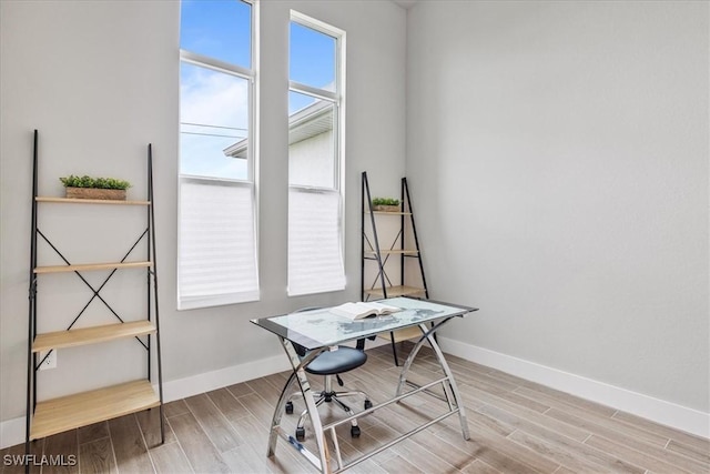 1142 SW 15th St, Cape Coral, FL 33991 - home office with baseboards and wood finished floors