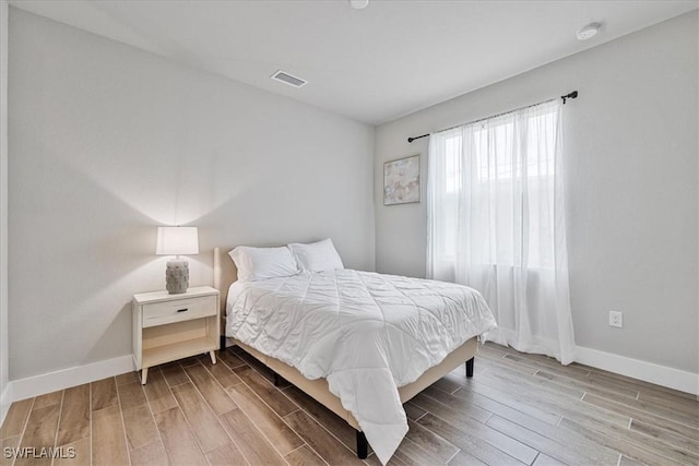 1142 SW 15th St, Cape Coral, FL 33991 - bedroom with wood finished floors and baseboards