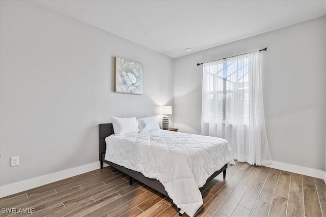 1142 SW 15th St, Cape Coral, FL 33991 - bedroom featuring wood finished floors and baseboards