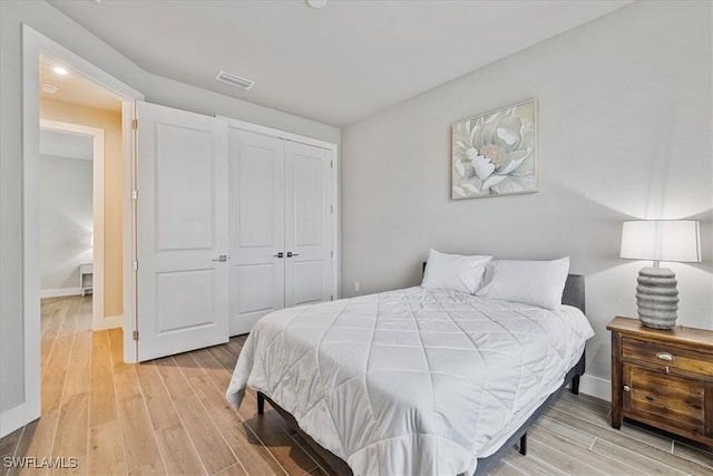1142 SW 15th St, Cape Coral, FL 33991 - bedroom featuring light wood finished floors, baseboards, a closet, and recessed lighting