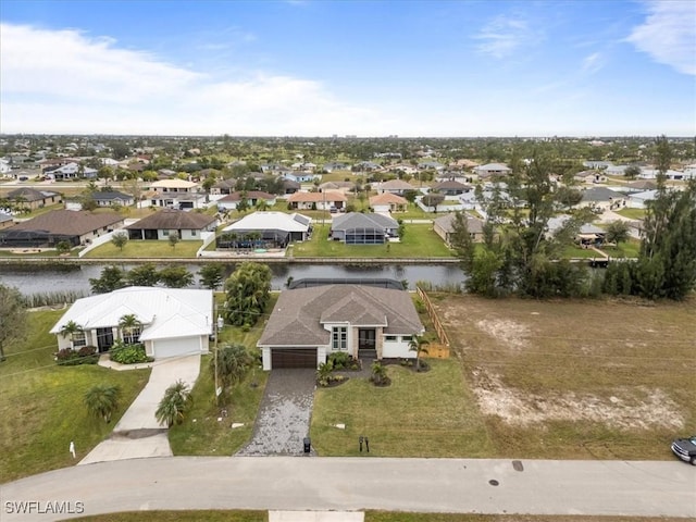 birds eye view of property with a water view