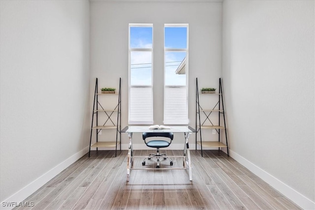 home office featuring light hardwood / wood-style flooring