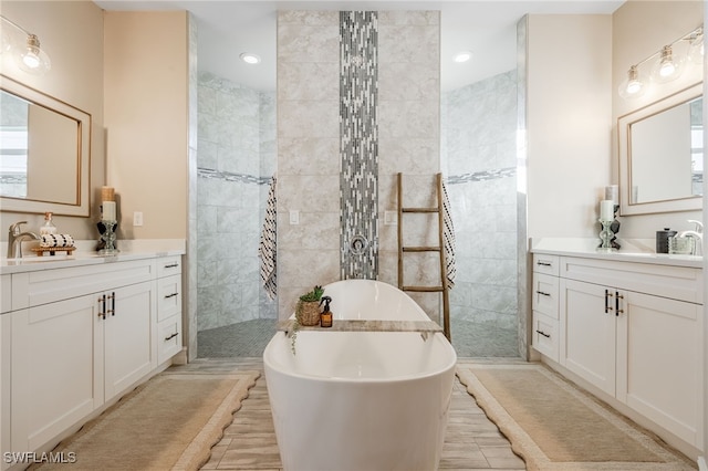 bathroom featuring vanity and plus walk in shower