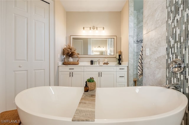 bathroom featuring a bathing tub and vanity