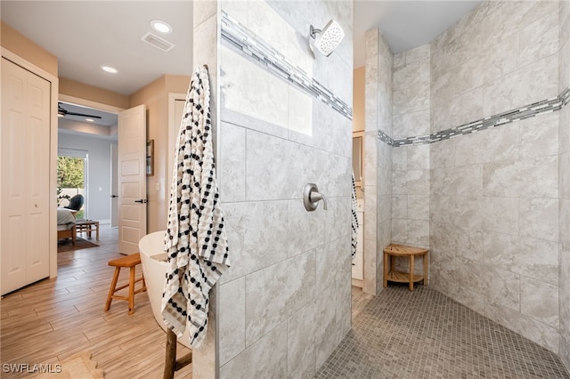 bathroom featuring a shower and ceiling fan