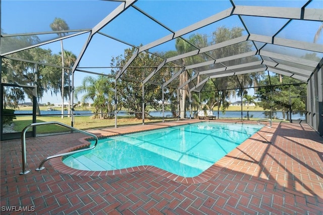 view of pool featuring glass enclosure and a patio