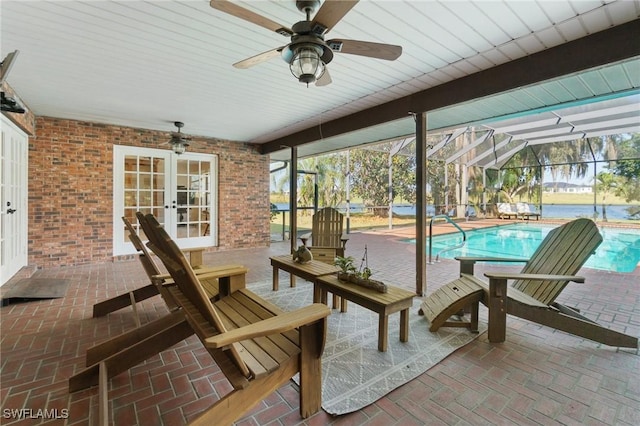 view of patio / terrace featuring glass enclosure, ceiling fan, and french doors