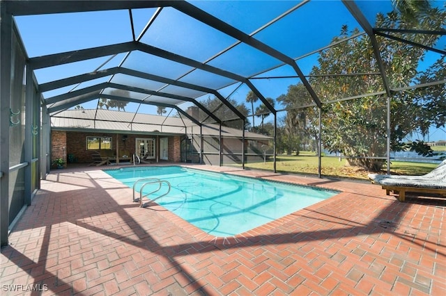 view of pool featuring a patio and a lanai