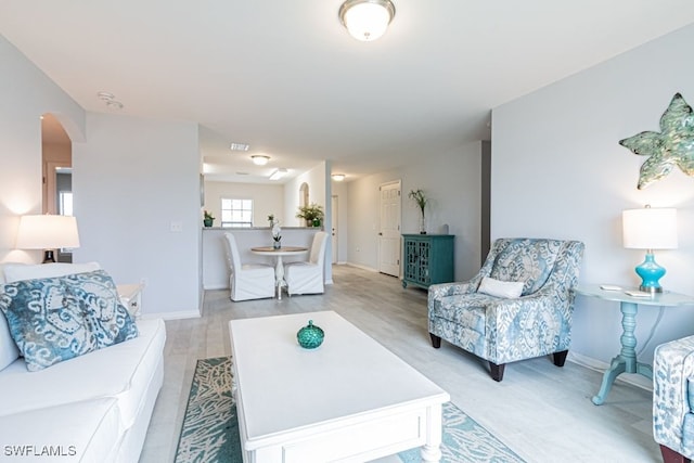 living room with light hardwood / wood-style flooring