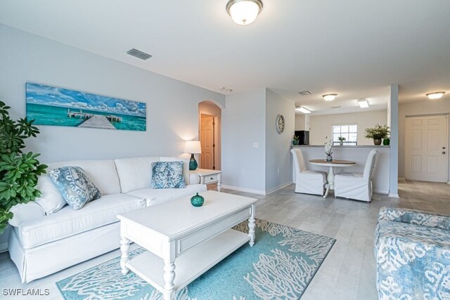 living room with light hardwood / wood-style floors