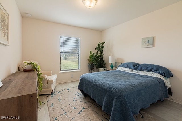 bedroom featuring light hardwood / wood-style floors