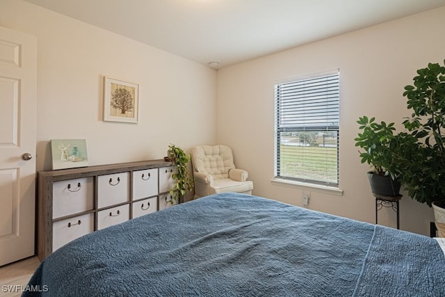 bedroom featuring multiple windows