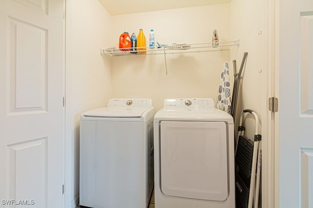 laundry area featuring washing machine and clothes dryer