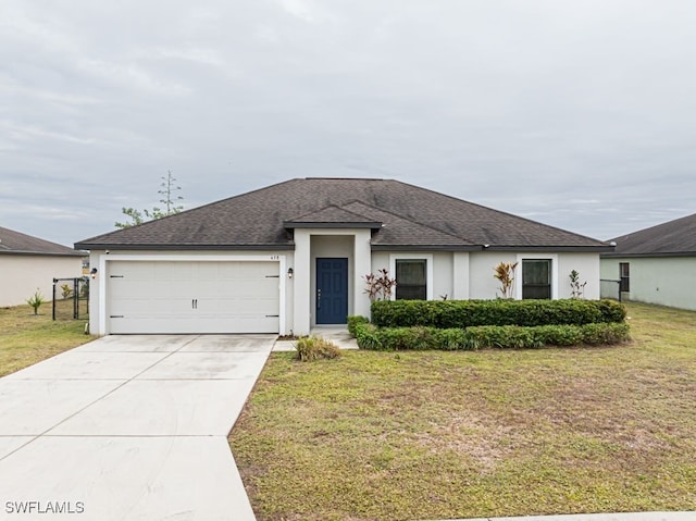 view of front facade featuring a garage and a front lawn