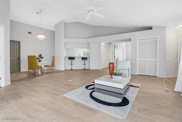 living room with vaulted ceiling and ceiling fan