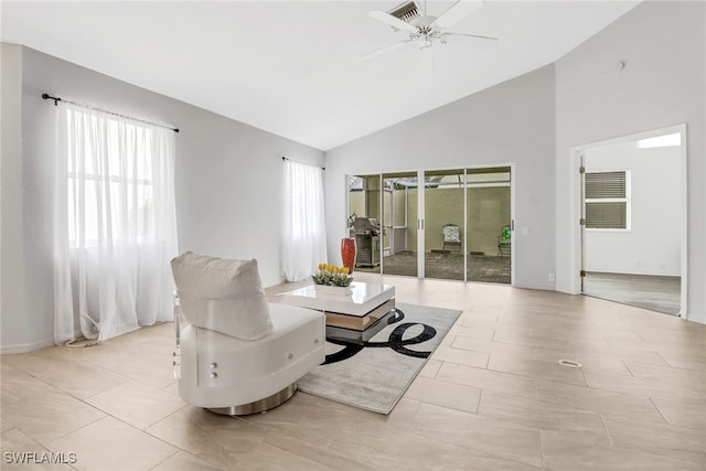 living room with light tile patterned flooring, high vaulted ceiling, and ceiling fan