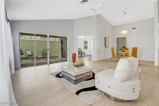 living room with high vaulted ceiling and ceiling fan