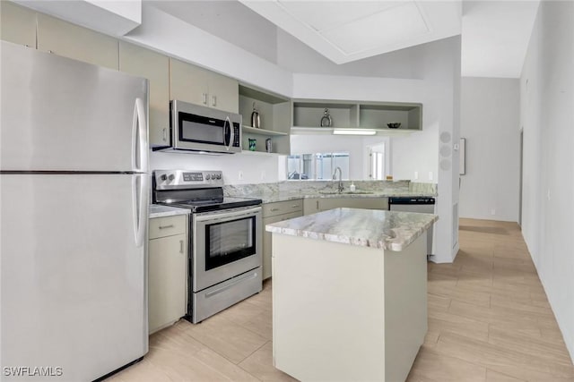 kitchen featuring stainless steel appliances, sink, and a kitchen island