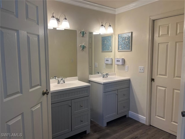 bathroom featuring vanity, hardwood / wood-style floors, and crown molding