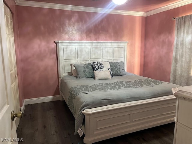 bedroom with ornamental molding and dark hardwood / wood-style floors