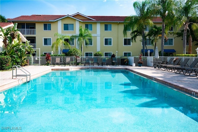 view of pool featuring a patio